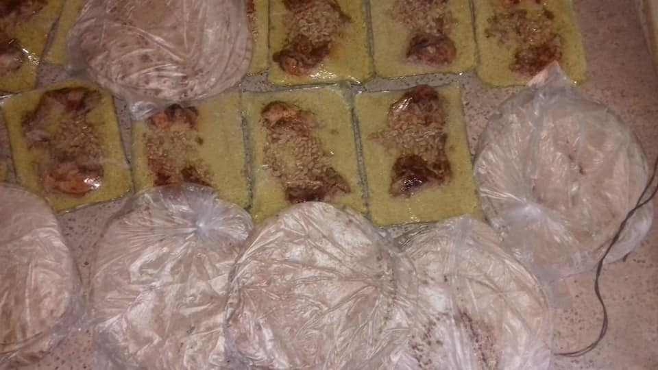 توزيع وجبات إفطار صائم في مخيم درعا 