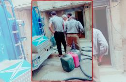 توزيع مادة مازوت التدفئة على الأسر في مخيم السبينة 