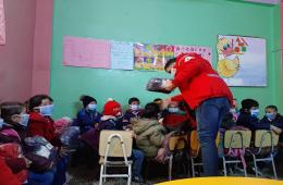 توزيع ملابس شتوية على الأطفال في مخيم خان الشيح 