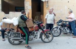 توزيع سلال غذائية على أكثر من 750 عائلة فلسطينية في مخيم درعا 