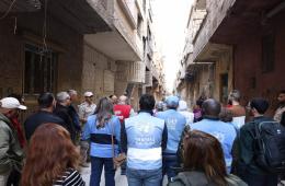 لتعزيز المساهمة في إزالة الألغام. وفد أممي يزور مخيم اليرموك