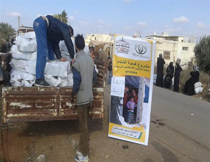 Palestine Charity organization distributes firewood on Palestinian families in Al Muzeireeb.