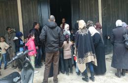 توزيع ملابس شتوية على أطفال فلسطينيي سورية في مخيم البداوي 